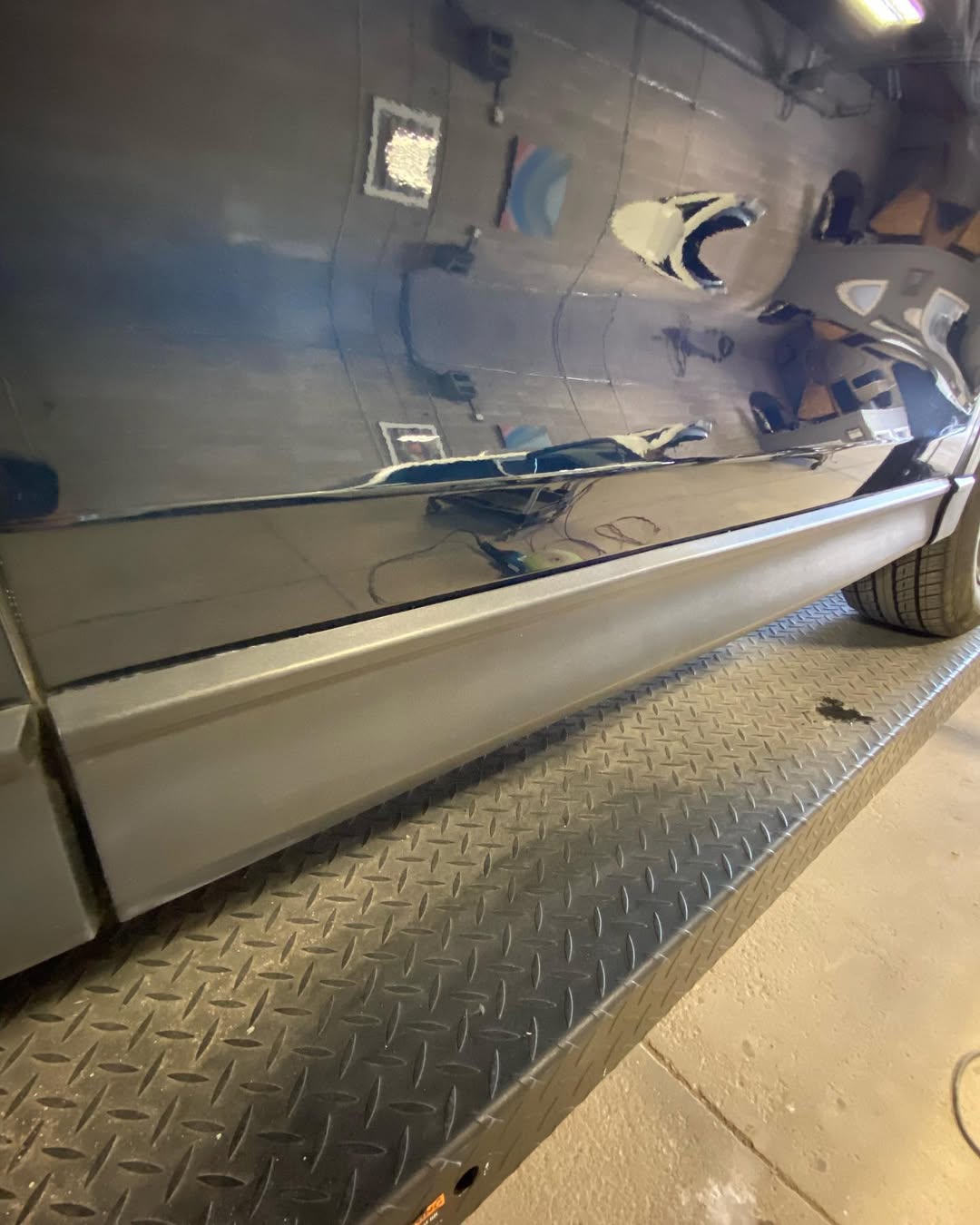 Repaired black car body panel