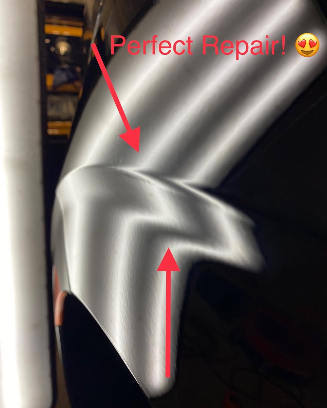 Repaired dark green car paint, close-up