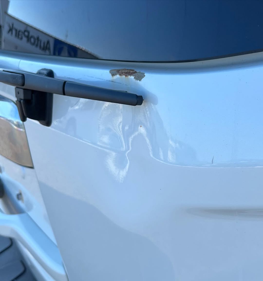 Light blue car panel with scratches