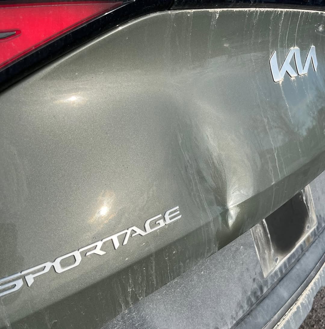 Dark gray car panel with scratches